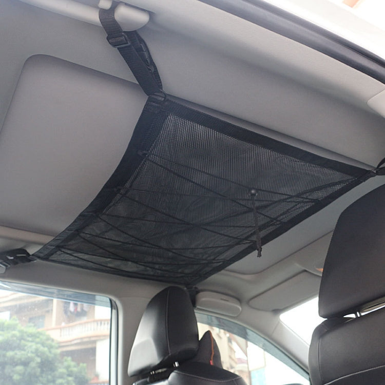 Black ceiling net storage bag with hanging straps on car roof