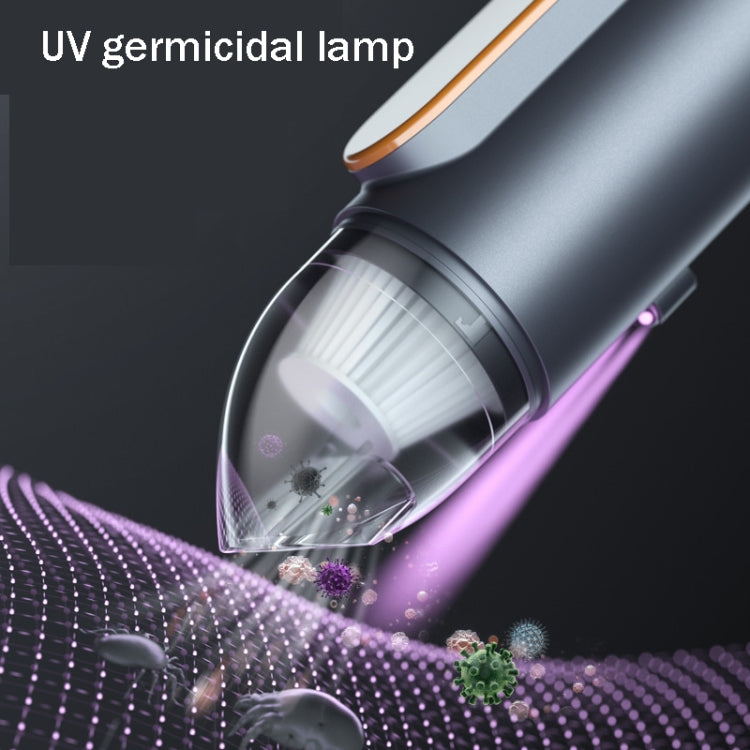Wireless handheld car vacuum cleaner with UV sterilizing lamp glow near transparent dust cup.
