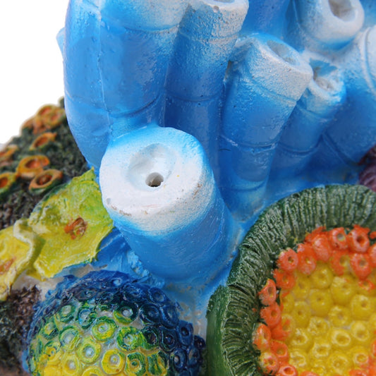 Close-up of blue artificial coral air stone with round outlet holes and textured detail