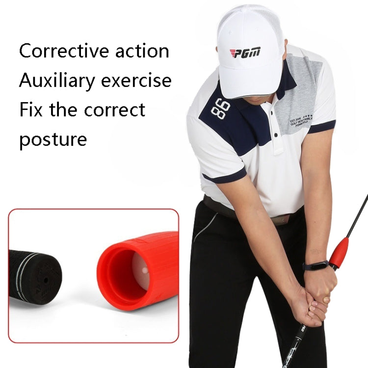 Golf training posture corrector stick with red head and black shaft in use