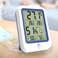 Digital wall thermometer and hygrometer display with green backlit screen and blue side buttons