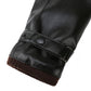 Black glove cuff close-up with snap button and knit trim
