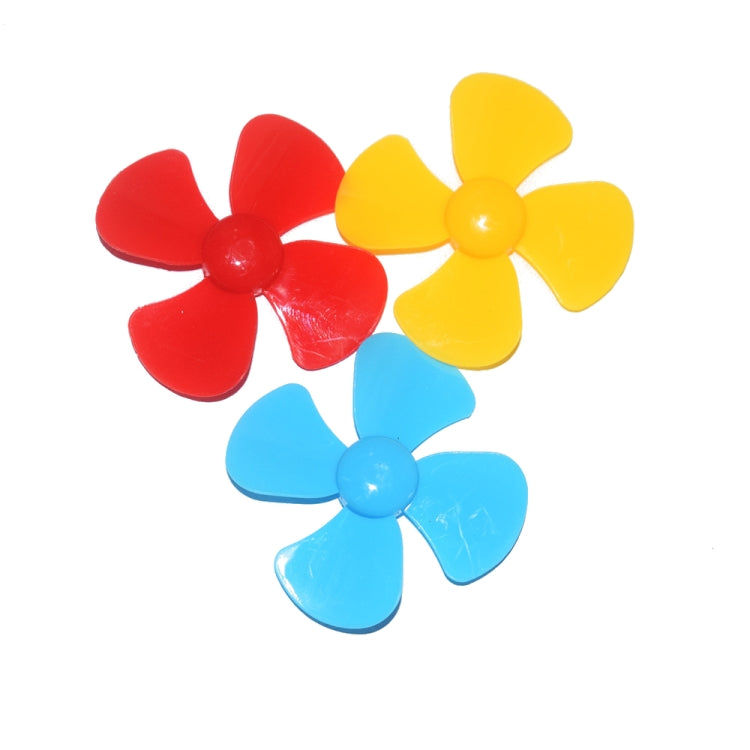 Toy four-blade propellers in red, yellow, and blue with central hub