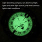 Luminous green diving compass face glowing in dark conditions