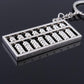 Silver abacus keychain pendant with key ring, close-up of bead rows in metal frame