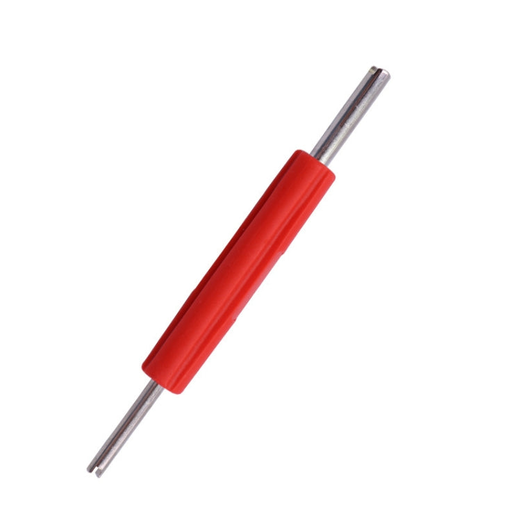 Red and silver valve core wrench tool with double-ended key prongs