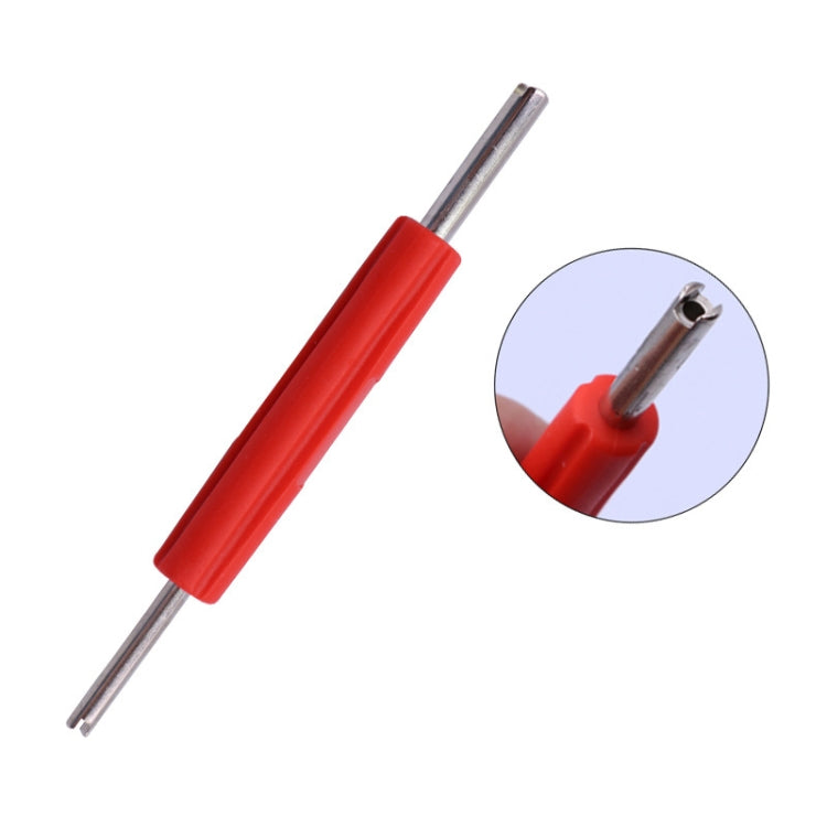 Valve core wrench key with red grip; inset shows tip on valve core