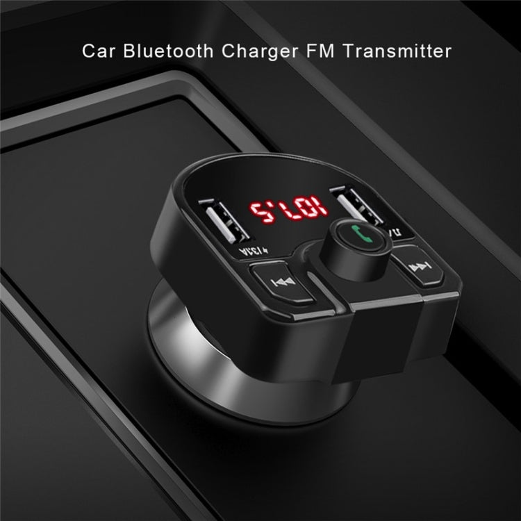 Black car Bluetooth FM charger with dual USB ports and red LED display on dash