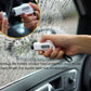 White safety hammer window breaker keychain in hand near shattered windshield