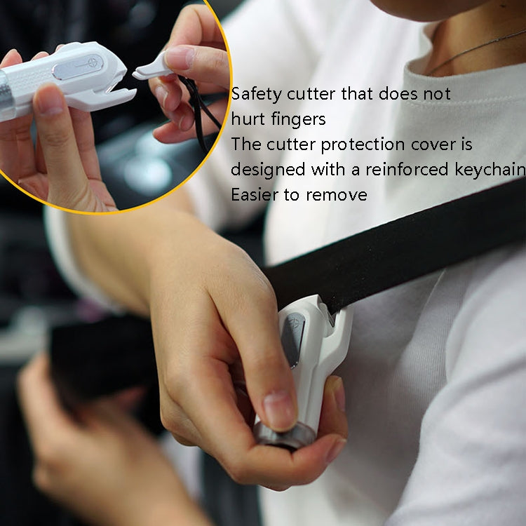 White safety hammer keychain with safety cutter cover held near seat belt area