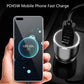 Black car USB-C charger held near smartphone, showing top charging ring light