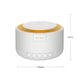 White cylindrical white-noise device with warm orange top ring and front control buttons