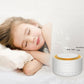 White cylindrical sleep sound device with warm orange top ring and front control panel