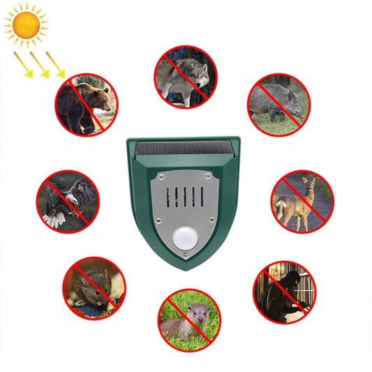 Solar animal alarm lamp with solar panel, green shield housing and round sensor
