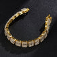 Gold-tone tennis bracelet with bright square rhinestones and hinged clasp.