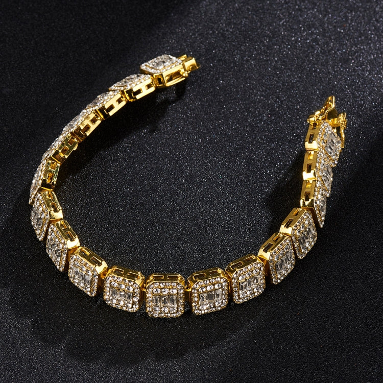 Gold-tone tennis bracelet with bright square rhinestones and hinged clasp.