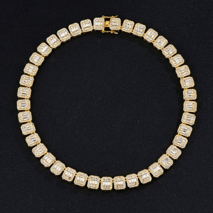 Gold-tone tennis bracelet with continuous square rhinestone stones, round profile.