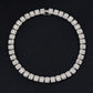 Silver-tone tennis bracelet with continuous square rhinestone stones, round profile.
