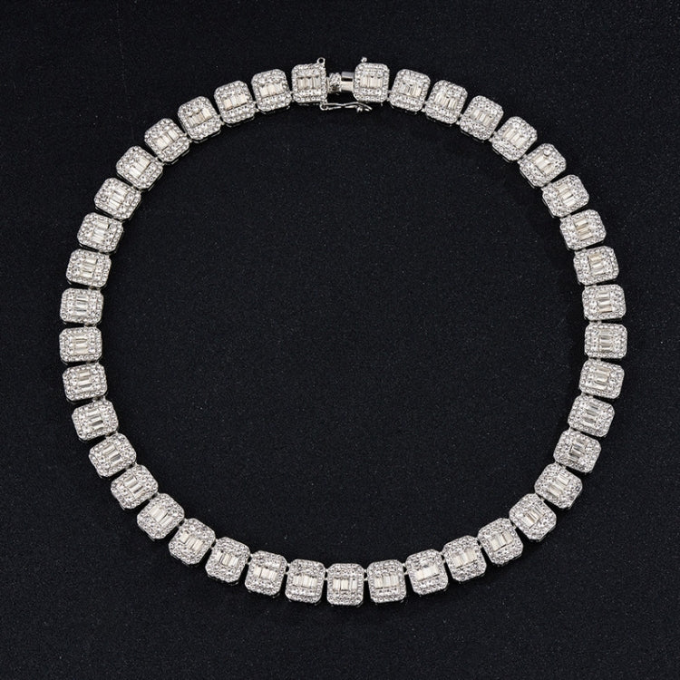 Silver-tone tennis bracelet with continuous square rhinestone stones, round profile.