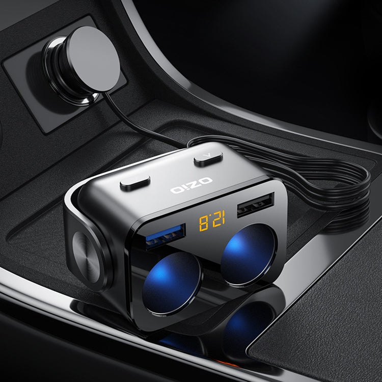 Ozio car charger close-up with dual blue USB ports, LED display, and cable connection