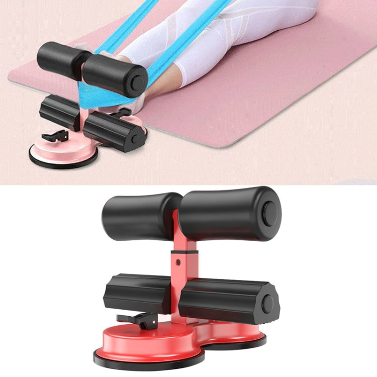 Red and black sit-up aid with dual suction bases and padded ankle supports