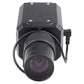 Black security box camera with large front lens and power cable, close front view