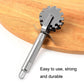Stainless steel five-wheel meat tenderizer tool on a wooden cutting board