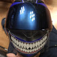 Motorcycle helmet teeth sticker on a blue helmet, white teeth with red outline