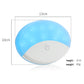 Compact dome LED car light with blue translucent lens and white base, power button