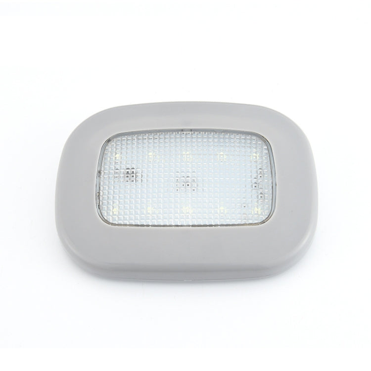 Gray dome LED trunk light with clear front panel and white illumination