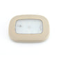 Beige dome LED trunk light with clear front panel and white illumination