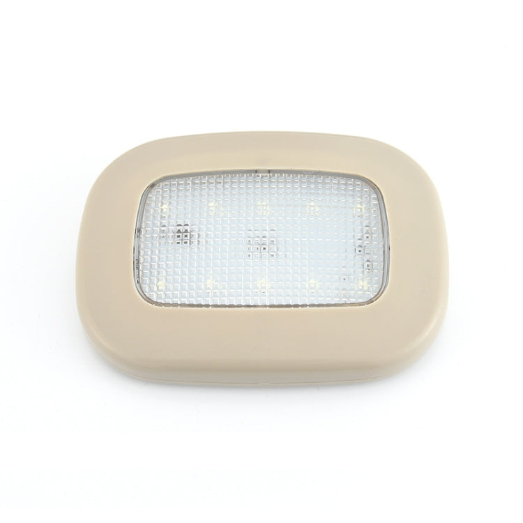 Beige dome LED trunk light with clear front panel and white illumination