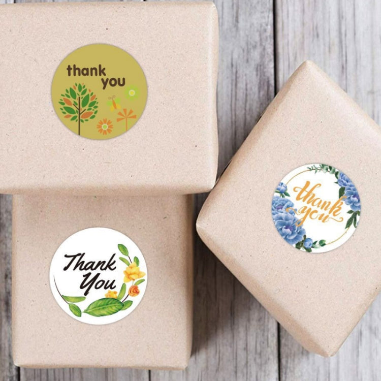 Round thank you tree flower stickers on kraft gift boxes, single sticker visible