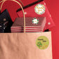 Round thank you tree flower sticker on kraft gift bag, small circular seal