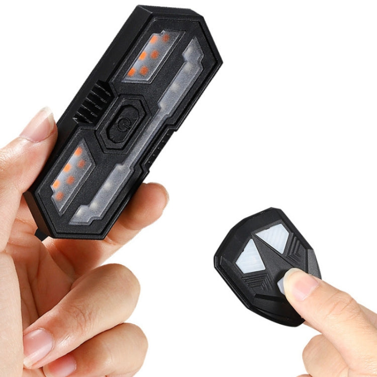 Bicycle tail light remote key fob, black, with buttons for lighting and horn