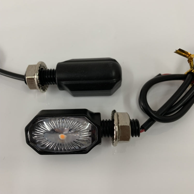 LED motorcycle turn signal light pair with amber lens, black housing, and threaded metal bases