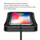 Front view of black wireless charging pad with smartphone placed on top