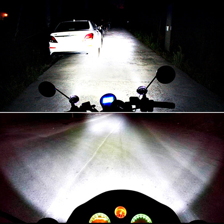 Pair of LED fog lamps projecting bright beam, round black housings