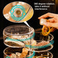 Transparent rotating jewelry box with front tier holding small accessories