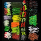 Assorted soft fishing lures with hooks, multi-color rows close-up
