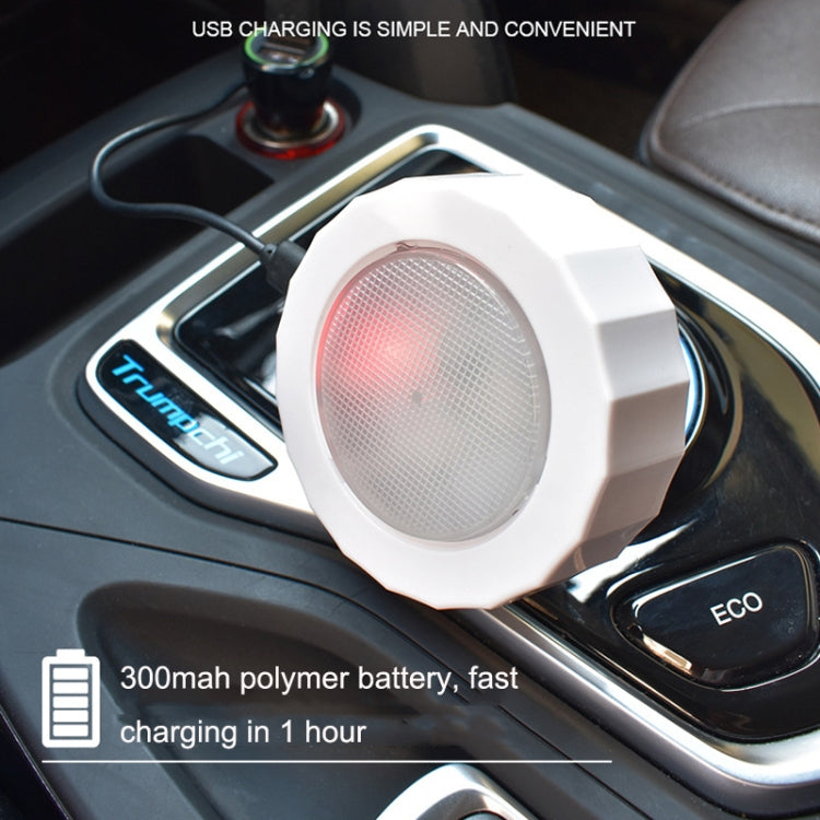 White octagonal LED car reading light placed near a vehicle USB port