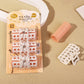 Hair curler set in retail pack with white-and-orange roller clips