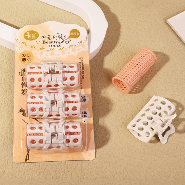 Hair curler set in retail pack with white-and-orange roller clips