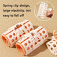 White lazy curlers with orange rollers and spring clip style ends