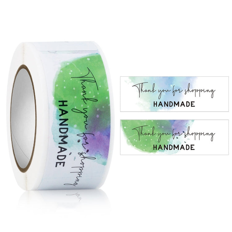 Rectangle sticker seal label roll with green watercolor and black "HANDMADE" thank you