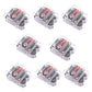 Set of automatic circuit breaker switches in clear cases with red labels and terminals.