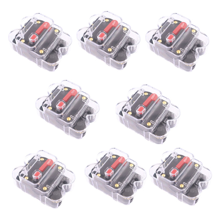Set of automatic circuit breaker switches in clear cases with red labels and terminals.