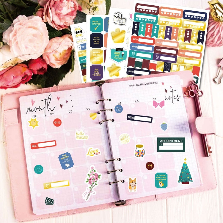 Planner binder pages decorated with colorful sticker icons and date boxes