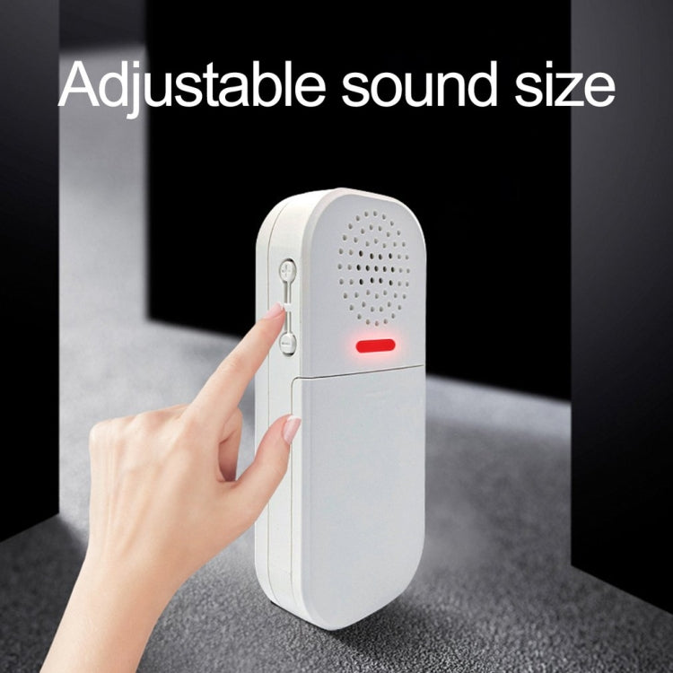 White door alarm with red indicator light and speaker grille, with remote control shown.