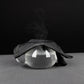 MG1050 cycling glove with textured fabric cuff, draped over a clear rounded prop